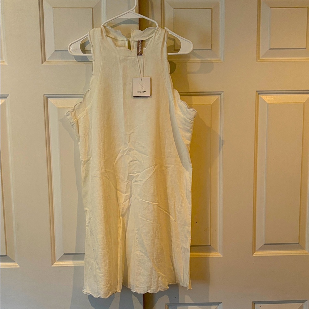 White cotton mini dress with ruffles